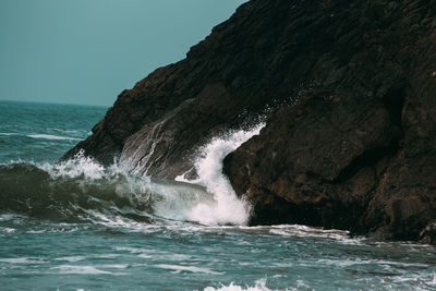 Waves, crash against the rocky coastline 