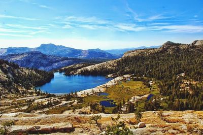 Scenic view of calm lake against mountain range