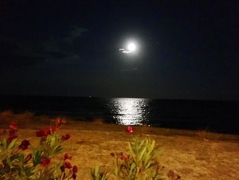 Scenic view of sea against sky at night