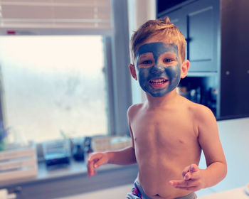 Portrait of smiling boy at home