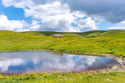 Lessinia mountains and a water pond
italian alps