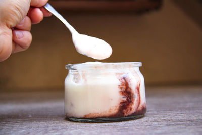 Close-up of hand holding ice cream