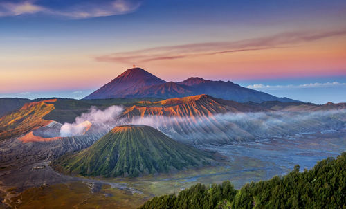 Scenic view of mountains against cloudy sky