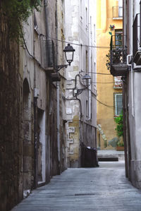 Narrow alley amidst buildings in city