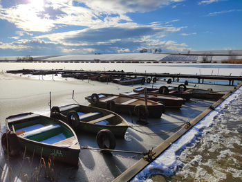 Boats moored at harbor