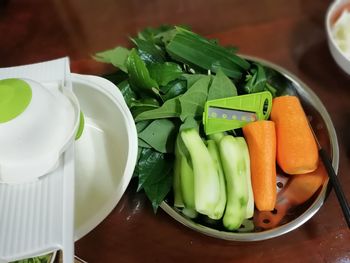 High angle view of chopped vegetables in bowl on table