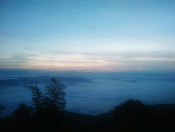Scenic view of silhouette mountain against sky at sunset