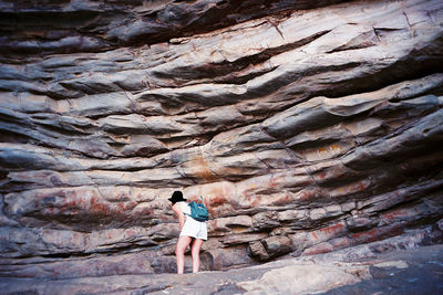 Woman standing on rock formation