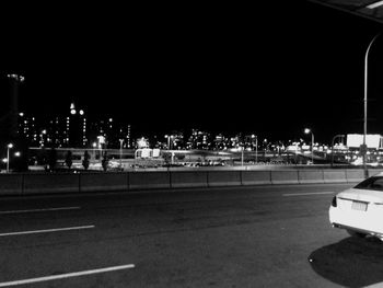 Illuminated city street at night