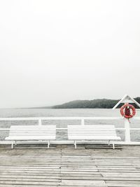 White bench on pier