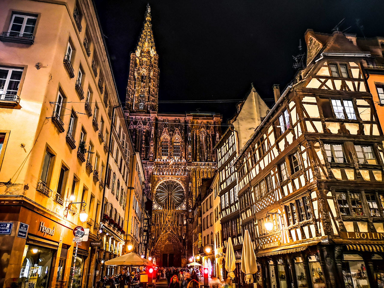 LOW ANGLE VIEW OF ILLUMINATED BUILDINGS IN CITY