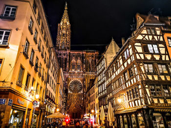 Low angle view of illuminated buildings at night