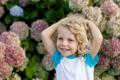 Portrait of smiling girl with plants