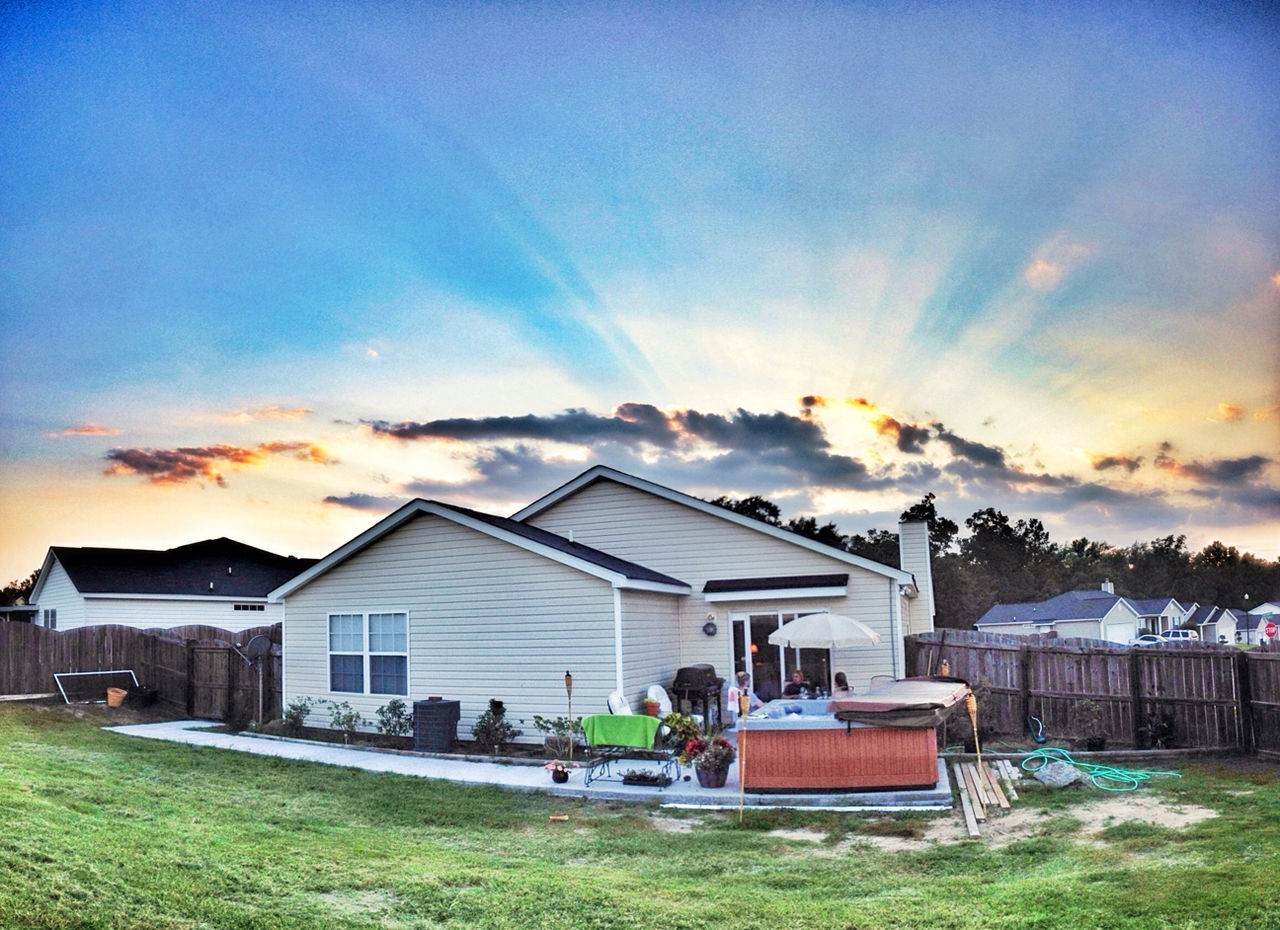 sky, building exterior, cloud - sky, architecture, built structure, sunset, house, grass, cloud, cloudy, beauty in nature, nature, scenics, landscape, tranquil scene, tranquility, field, sunlight, residential structure, orange color