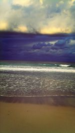 Scenic view of sea against cloudy sky