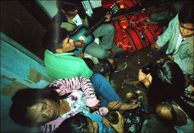 High angle view of people relaxing on floor