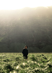 Portrait of man standing on field