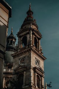 Low angle view of clock tower against sky