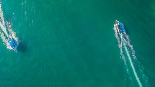 High angle view of airplane flying over sea