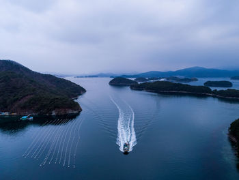 Boat in lake against sky