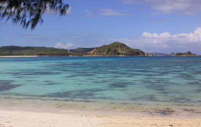 Scenic view of sea against blue sky