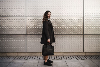 Full length of woman standing on floor