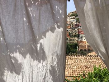 Positano seen from white curtain