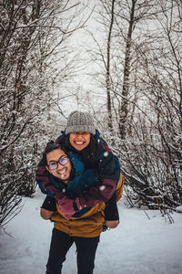 Portrait of smiling woman in snow