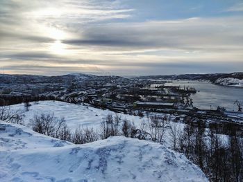 Scenic view of snow covered mountains against sky