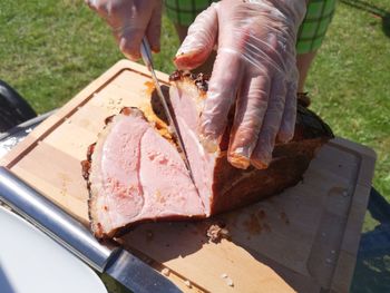 High angle view of person preparing food on cutting board