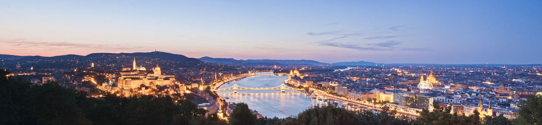 Panoramic view of chain bridge over danube river at sunset