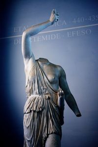 Close-up of statue against blue sky