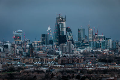 Modern buildings in city against sky