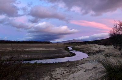 Scenic view of landscape against sky during sunset