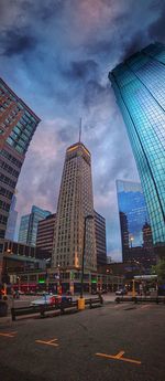 Skyscrapers against cloudy sky