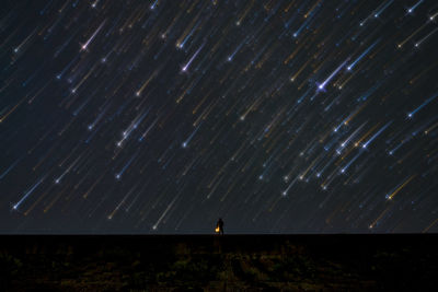 Low angle view of people at night