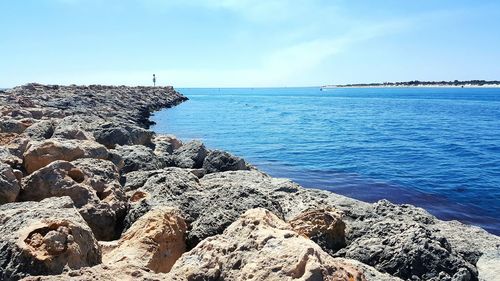 View of calm blue sea against sky