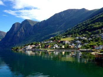 Scenic view of lake and mountains against sky