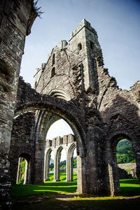 Low angle view of old ruins against clear sky