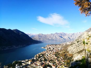 Scenic view of mountains against blue sky