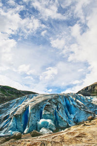 Scenic view of glacier against sky