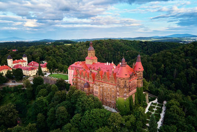 High angle view of trees and buildings against sky