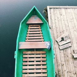 High angle view of boat moored by pier at lake