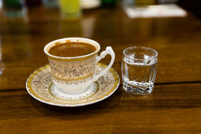 Close-up of coffee cup on table
