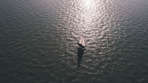 High angle view of man standing in sea
