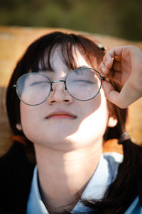 Close-up portrait of woman with eyeglasses