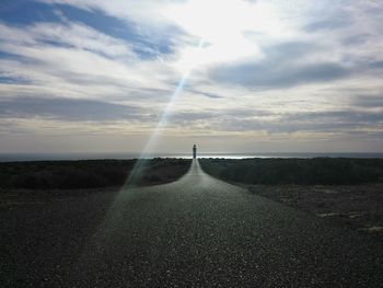 Scenic view of sea against cloudy sky