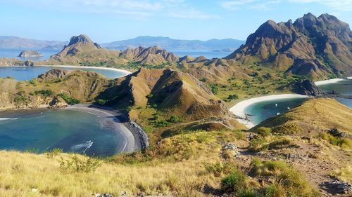 High angle view of land and mountains against sky