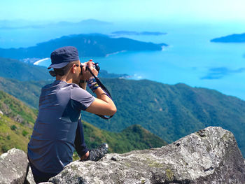 Man photographing on mountain