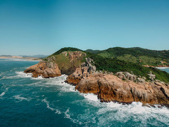 Scenic view of sea against clear blue sky